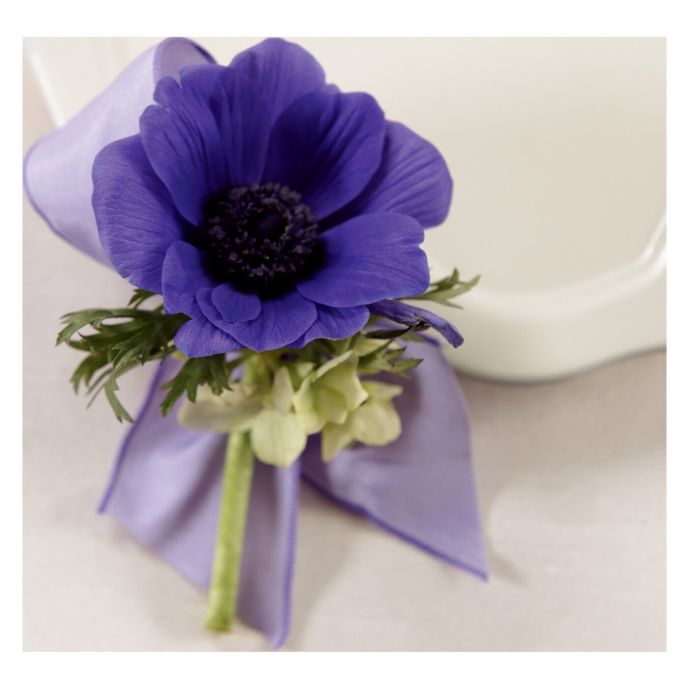 Purple Passion Boutonniere flower arrangement